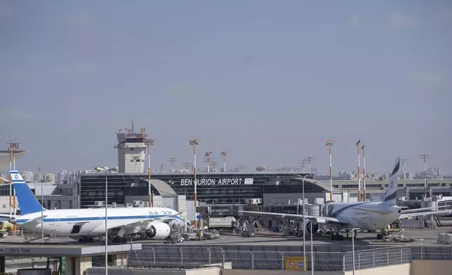 Two planes are parked at Ben Gurion International Airport near Tel Aviv, Israel, Monday Sept. 2, 2024. Outgoing flights at the airport were halted for two hours on Monday morning as part of a general strike launched in response to the deaths of hostages held in Gaza. (AP Photo/Ohad Zwigenberg)