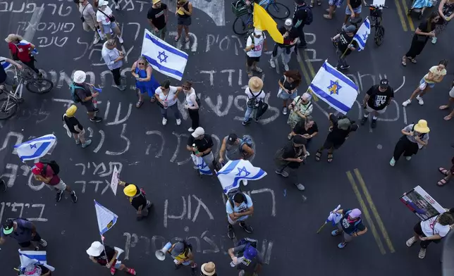 Demonstrators demanded a cease-fire deal and the immediate release of hostages held by Hamas in the Gaza Strip after the deaths of six hostages in the Palestinian territory, in Tel Aviv, Israel, on Monday, Sept. 2, 2024. (AP Photo/Ohad Zwigenberg)