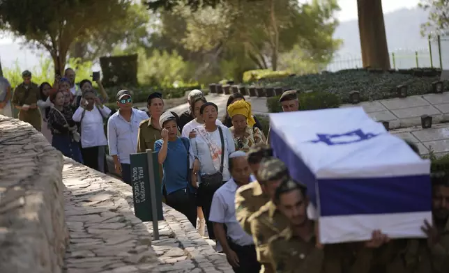 Family follow as Israeli soldiers carry the casket of first sergeant Geri Gideon Hanghal during his funeral at the Mount Herzl military cemetery in Jerusalem, Thursday, Sept. 12, 2024. (AP Photo/Ohad Zwigenberg)