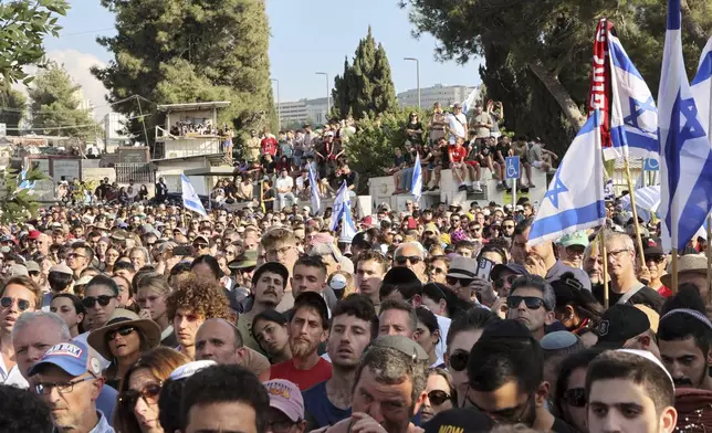 Mourners attend the funeral of Israeli-American hostage Hersh Goldberg-Polin, who was killed in Hamas captivity in the Gaza Strip, in Jerusalem, Monday, Sept. 2, 2024. (Gil Cohen-Magen/Pool via AP)