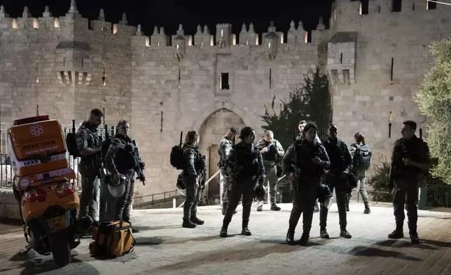 Israeli security forces stand guard near the scene of a stabbing attack at Damascus Gate in Jerusalem's Old City, Sunday, Sept. 15, 2024. (AP Photo/Mahmoud Illean)