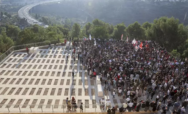 Mourners gather for the burial of Israeli-American hostage Hersh Goldberg-Polin, who was killed in Hamas captivity in the Gaza Strip, attend their son's funeral in Jerusalem, Monday, Sept. 2, 2024. (Gil Cohen-Magen/Pool via AP)