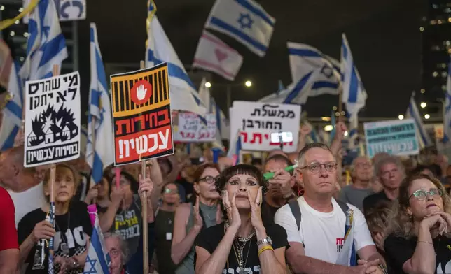 People protest against Prime Minister Benjamin Netanyahu's government in Tel Aviv, Israel, Saturday, Aug. 31, 2024. (AP Photo/Ohad Zwigenberg)