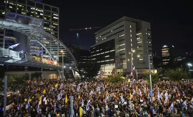 People attend a rally demanding a cease-fire deal and the immediate release of hostages held by Hamas in the Gaza Strip in Tel Aviv, Israel, on Tuesday, Sept. 3, 2024. (AP Photo/Ariel Schalit)