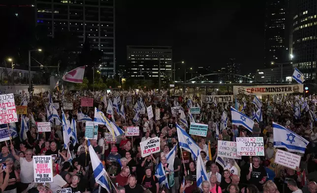 People protest against Israeli Prime Minister Benjamin Netanyahu's government in Tel Aviv, Israel, Saturday, Aug. 31, 2024. (AP Photo/Ohad Zwigenberg)