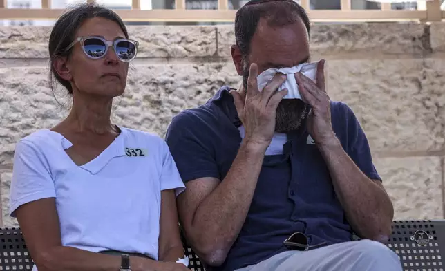 Jonathan Polin and Rachel Goldberg, parents of Israeli-American hostage Hersh Goldberg-Polin, who was killed in Hamas captivity in the Gaza Strip, attend their son's funeral in Jerusalem, Monday, Sept. 2, 2024. (Gil Cohen-Magen/Pool via AP)