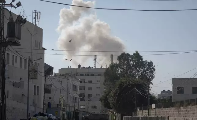 Smoke rises after an explosion during an Israeli military operation in the West Bank Jenin refugee camp, Wednesday, Sept. 25, 2024. (AP Photo/Majdi Mohammed)