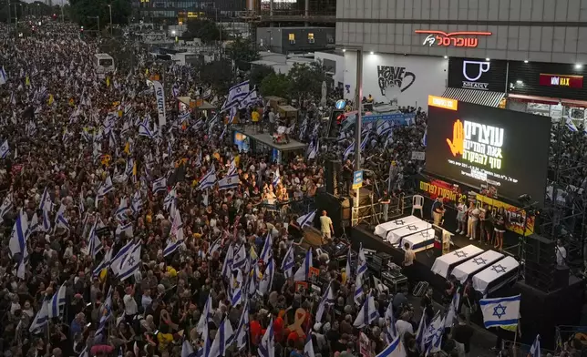 People take part in a protest calling for a deal for immediate release of hostages held in the Gaza Strip by the Hamas militant group, in Tel Aviv, Sunday, Sept. 1, 2024. (AP Photo/Ariel Schalit)