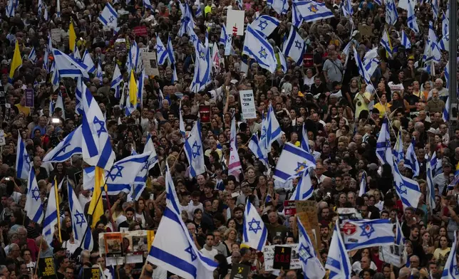 People take part in a protest calling for a deal for immediate release of hostages held in the Gaza Strip by the Hamas militant group, in Tel Aviv, Israel, Sunday, Sept. 1, 2024. (AP Photo/Ariel Schalit)