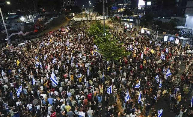 People attend a rally demanding a cease-fire deal and the immediate release of hostages held by Hamas on Wednesday, Sept. 4, 2024, in Tel Aviv, Israel. (AP Photo/Ariel Schalit)