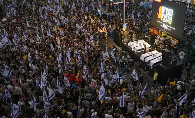 People take part in a protest calling for a deal for immediate release of hostages held in the Gaza Strip by the Hamas militant group, in Tel Aviv, Sunday, Sept. 1, 2024. (AP Photo/Ariel Schalit)