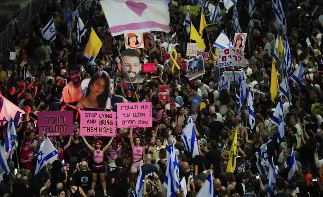 People protest against Prime Minister Benjamin Netanyahu's government and call for the release of hostages held in the Gaza Strip by the Hamas militant group, in Tel Aviv, Israel, Saturday, Sept. 7, 2024. (AP Photo/Ariel Schalit)