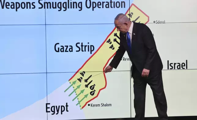 Israeli Prime Minister Benjamin Netanyahu gestures in front of a map during a press conference at the Government Press office in Jerusalem, Wednesday, Sept. 4, 2024. (Abir Sultan/Pool via AP)