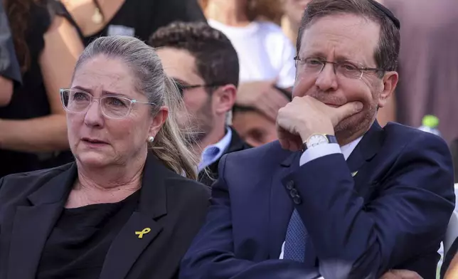 Israel's President Isaac Herzog and his wife Michal attend the funeral of Israeli-American hostage Hersh Goldberg-Polin, who was killed in Hamas captivity in the Gaza Strip, in Jerusalem, Monday, Sept. 2, 2024. (Gil Cohen-Magen/Pool via AP)