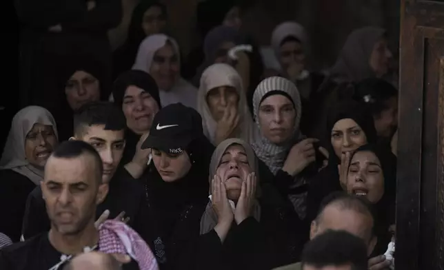 A woman grieves during the funeral for three Palestinian militants killed in an Israeli military operation in the West Bank town of Qabatiya, Friday, Sept. 20, 2024. (AP Photo/Majdi Mohammed)