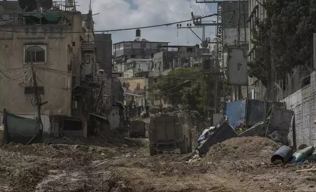 A convoy of Israeli military armored vehicles is seen during an army raid in Tulkarem, West Bank, on Tuesday, Sept. 3, 2024. (AP Photo/Majdi Mohammed)