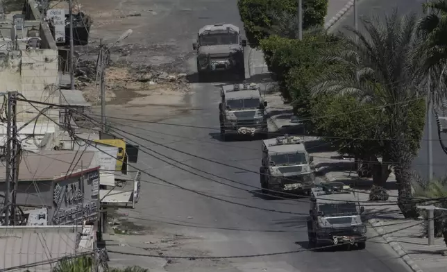 Israeli military vehicles maneuver during an operation in the West Bank city of Jenin, Thursday, Sept. 5, 2024. (AP Photo/Majdi Mohammed)