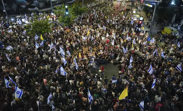 People attend a rally demanding a cease-fire deal and the immediate release of hostages held by Hamas in the Gaza Strip in Tel Aviv, Israel, on Tuesday, Sept. 3, 2024. (AP Photo/Ariel Schalit)