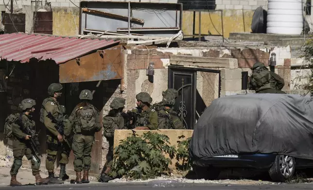 Israeli soldiers are seen during an army raid in Tubas, West Bank, on Wednesday, Sept. 11, 2024. (AP Photo/Majdi Mohammed)