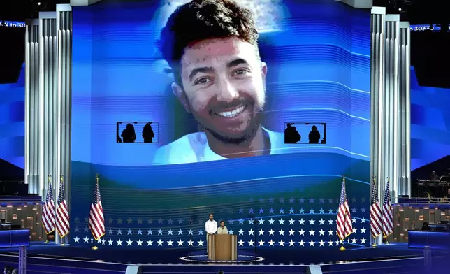 FILE - Jon Polin, left, and Rachel Goldberg, parents of Hersh Goldberg-Polin, pictured on screen speak during the Democratic National Convention Wednesday, Aug. 21, 2024, in Chicago. (AP Photo/J. Scott Applewhite, File)