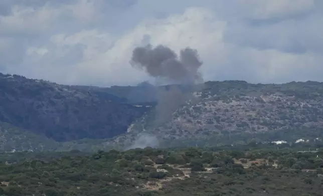 Smoke rises in northern Israel following a rocket strike from Lebanon, Thursday, Sept. 19, 2024. (AP Photo/Baz Ratner)