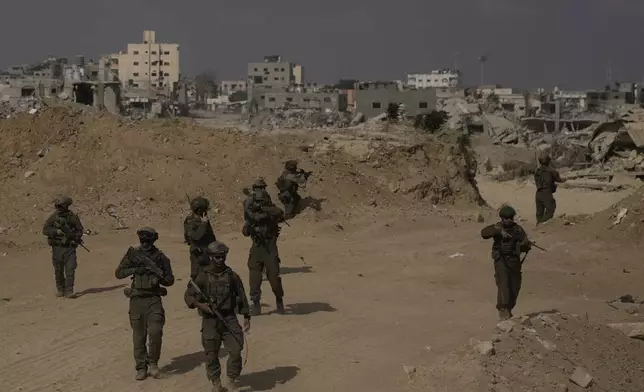 Israeli soldiers take up positions during a ground operation in the southern Gaza Strip on Friday, Sept. 13, 2024. (AP Photo/Leo Correa)