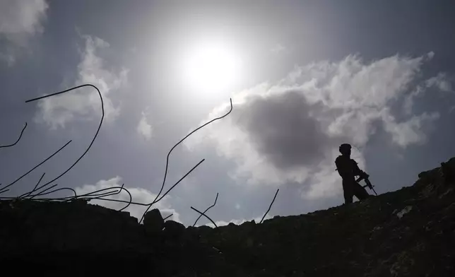 Israeli soldiers take up positions next to the Philadelphi corridor along the border with Egypt, in the Gaza Strip on Friday, Sept. 13, 2024. (AP Photo/Leo Correa)