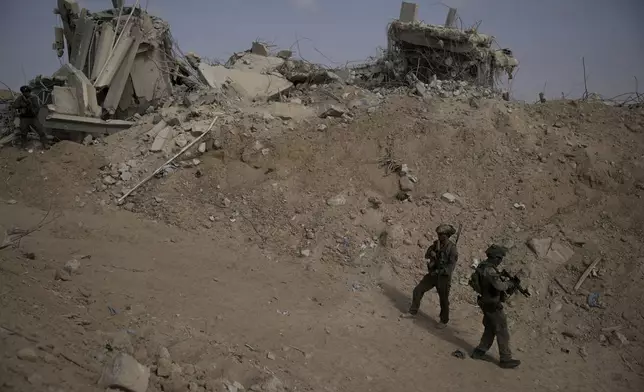 Israeli soldiers take up positions during a ground operation in the Gaza Strip on Friday, Sept. 13, 2024. (AP Photo/Leo Correa)