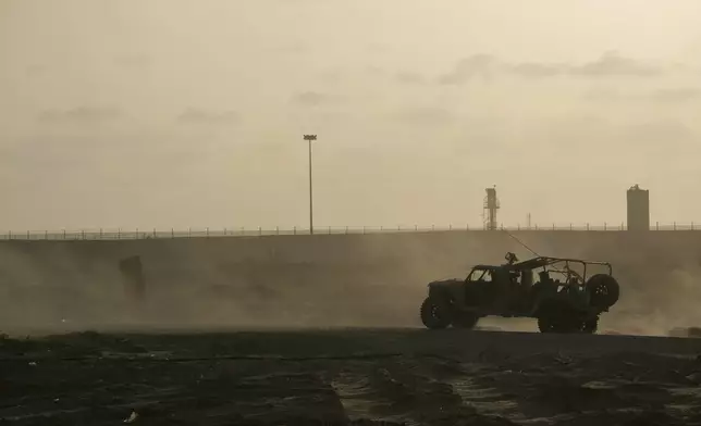 Israeli soldiers move on the Philadelphi corridor along the border with Egypt, in the Gaza Strip on Friday, Sept. 13, 2024. (AP Photo/Leo Correa)