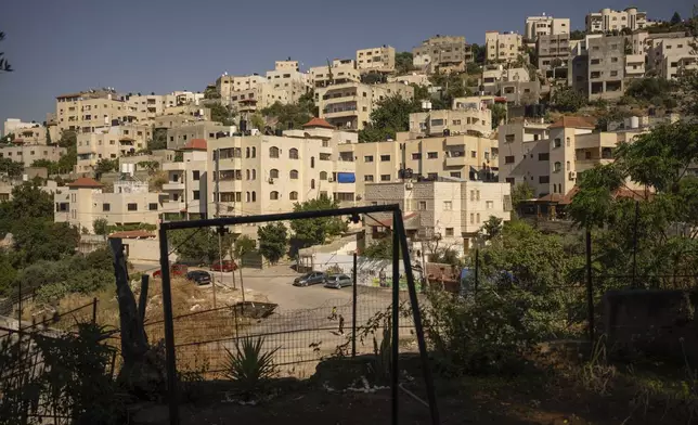 A view of Jenin refugee camp is seen from the Hamadneh family's house in the West Bank, Wednesday, June 5, 2024. Their 15-year-old son Mahmoud was killed by an Israeli sniper on his way home from school. (AP Photo/Bram Janssen)