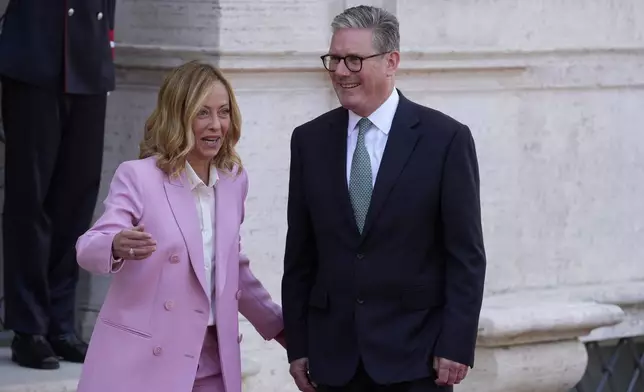 Italian Premier Giorgia Meloni, left, welcomes U.K. Prime Minister Keir Starmer as they meet at Villa Panphilj in Rome, Monday, Sept. 16, 2024. U.K. Prime Minister Keir Starmer is meeting Italian Premier Giorgia Meloni in Rome on Monday, as the two very different politicians, from left and right, seek common cause to curb migrants reaching their shores by boat. The visit comes after at least eight seaborne migrants died off the French coast over the weekend. (AP Photo Andrew Medichini)