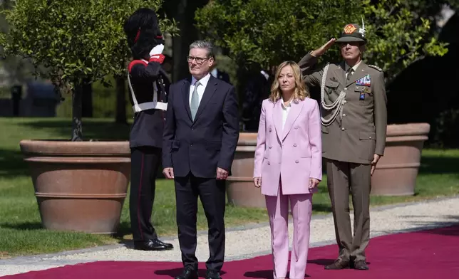 Italian Premier Giorgia Meloni, second from right, welcomes U.K. Prime Minister Keir Starmer as they meet at Villa Panphilj in Rome, Monday, Sept. 16, 2024. U.K. Prime Minister Keir Starmer is meeting Italian Premier Giorgia Meloni in Rome on Monday, as the two very different politicians, from left and right, seek common cause to curb migrants reaching their shores by boat. The visit comes after at least eight seaborne migrants died off the French coast over the weekend. (AP Photo Andrew Medichini)