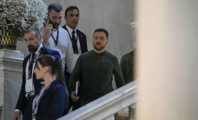 Ukraine's President Volodymyr Zelenskyy, right, leaves after meeting with Italian Premier Giorgia Meloni at the Ambrosetti Forum in Cernobbio, northern Italy, Saturday, Sept. 7, 2024. (AP Photo/Luca Bruno)