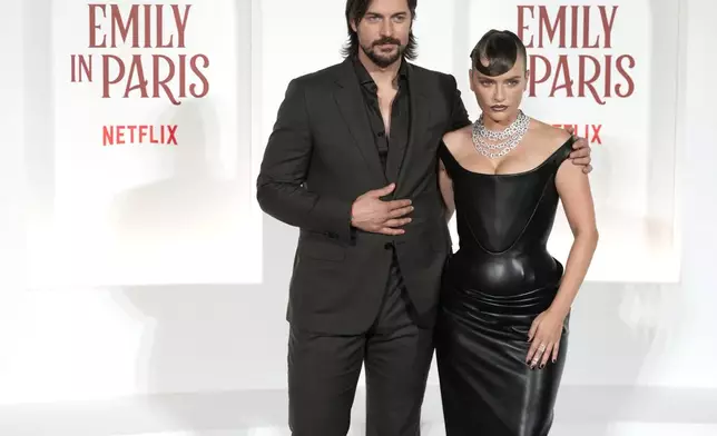 Lucas Bravo and Camille Razat arrive at the premiere of "Emily in Paris", in Rome, Tuesday, Sept. 10, 2024. (AP Photo/Andrew Medichini)