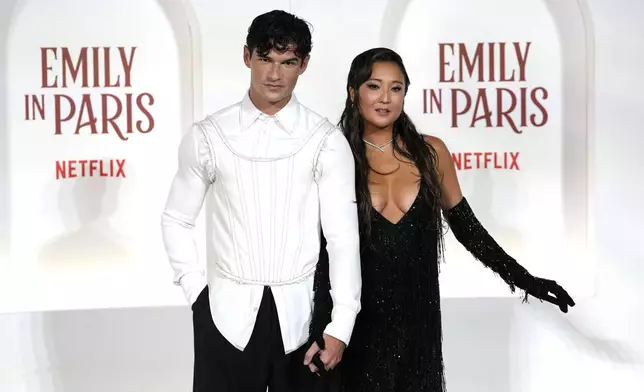 Actors Paul Forman, left, and Ashley Park arrive at the premiere of "Emily in Paris", in Rome, Tuesday, Sept. 10, 2024. (AP Photo/Andrew Medichini)