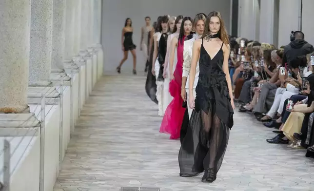 Models wear creations as part of the Alberta Ferretti Spring Summer 2025 collection, that was presented in Milan, Italy, Tuesday, Sept. 17, 2024. (AP Photo/Luca Bruno).