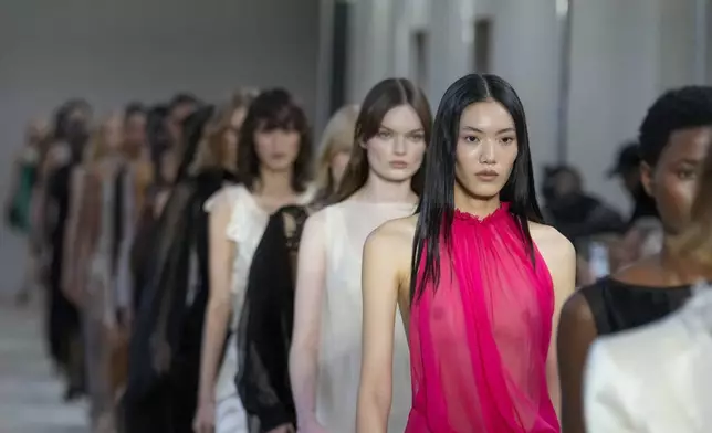 Models wear creations as part of the Alberta Ferretti Spring Summer 2025 collection, that was presented in Milan, Italy, Tuesday, Sept. 17, 2024. (AP Photo/Luca Bruno).