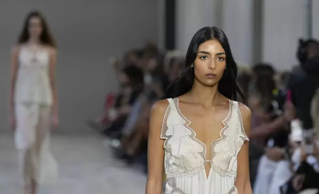 A model wears a creation as part of the Alberta Ferretti Spring Summer 2025 collection, that was presented in Milan, Italy, Tuesday, Sept. 17, 2024. (AP Photo/Luca Bruno).