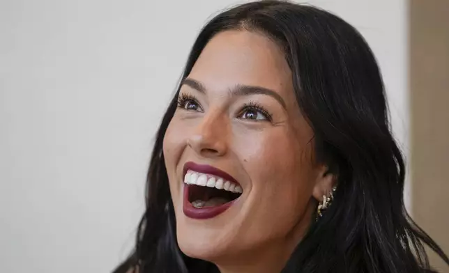 Model Ashley Graham arrives to attend the Alberta Ferretti Spring Summer 2025 collection, that was presented in Milan, Italy, Tuesday, Sept. 17, 2024. (AP Photo/Luca Bruno).