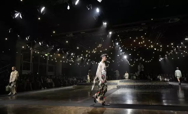 Models wear creations as part of the Antonio Marras Spring Summer 2025 collection, that was presented in Milan, Italy, Wednesday, Sept. 18, 2024. (AP Photo/Luca Bruno).