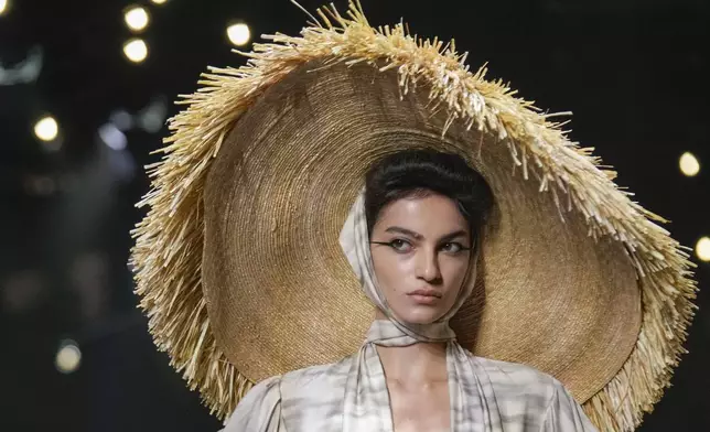 A model wears a creation as part of the Antonio Marras Spring Summer 2025 collection, that was presented in Milan, Italy, Wednesday, Sept. 18, 2024. (AP Photo/Luca Bruno).