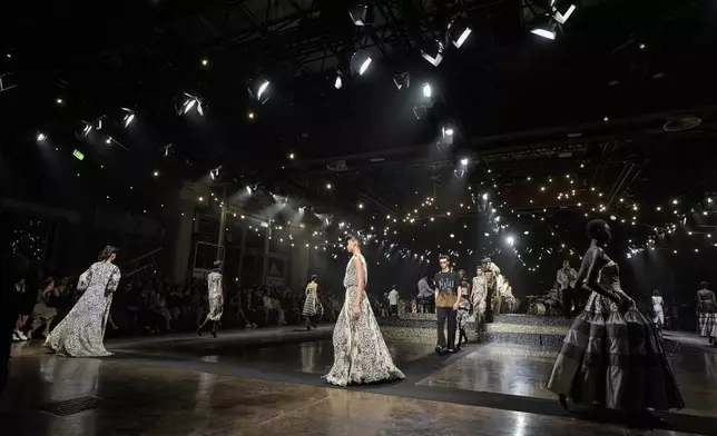 Models wear creations as part of the Antonio Marras Spring Summer 2025 collection, that was presented in Milan, Italy, Wednesday, Sept. 18, 2024. (AP Photo/Luca Bruno).