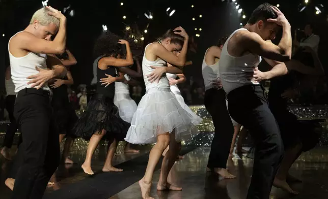 Dancers perform during the Antonio Marras Spring Summer 2025 collection, that was presented in Milan, Italy, Wednesday, Sept. 18, 2024. (AP Photo/Luca Bruno).