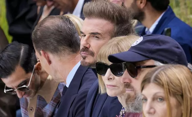 Former soccer star David Beckham attends the Boss Spring Summer 2025 fashion show, that was presented in Milan, Italy, Wednesday, Sept. 18, 2024. (AP Photo/Antonio Calanni).