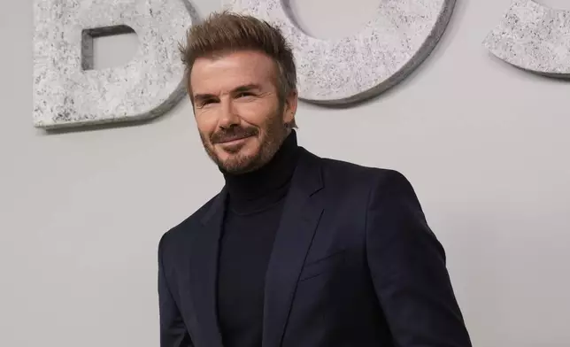 Former soccer star David Beckham attends the Boss Spring Summer 2025 fashion show, that was presented in Milan, Italy, Wednesday, Sept. 18, 2024. (AP Photo/Antonio Calanni).