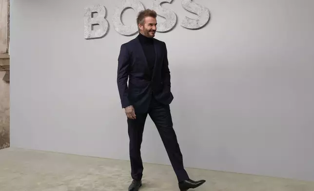 Former soccer star David Beckham attends the Boss Spring Summer 2025 fashion show, that was presented in Milan, Italy, Wednesday, Sept. 18, 2024. (AP Photo/Antonio Calanni).