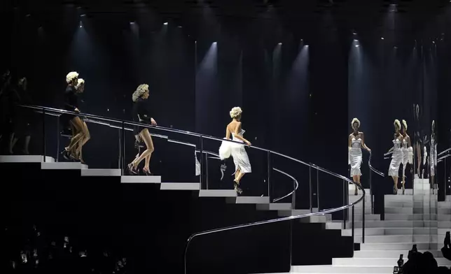 Models wear creations as part of the Dolce &amp; Gabbana Spring Summer 2025 collection, that was presented in Milan, Italy, Saturday, Sept. 21, 2024. (AP Photo/Antonio Calanni)
