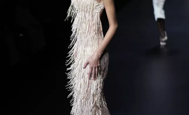 A model wears a creation as part of the Dolce &amp; Gabbana Spring Summer 2025 collection, that was presented in Milan, Italy, Saturday, Sept. 21, 2024. (AP Photo/Antonio Calanni)