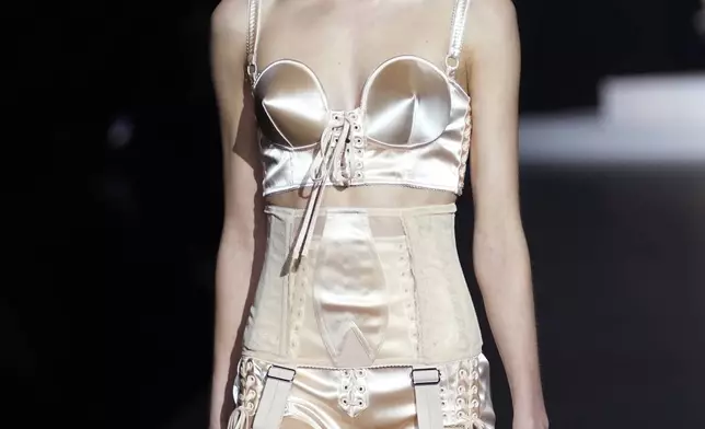 A model wears a creation as part of the Dolce &amp; Gabbana Spring Summer 2025 collection, that was presented in Milan, Italy, Saturday, Sept. 21, 2024. (AP Photo/Antonio Calanni)