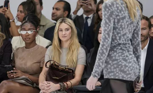 Normani, left, and Shailene Woodley attend the Fendi Spring Summer 2025 collection, that was presented in Milan, Italy, Tuesday, Sept. 17, 2024. (AP Photo/Luca Bruno).